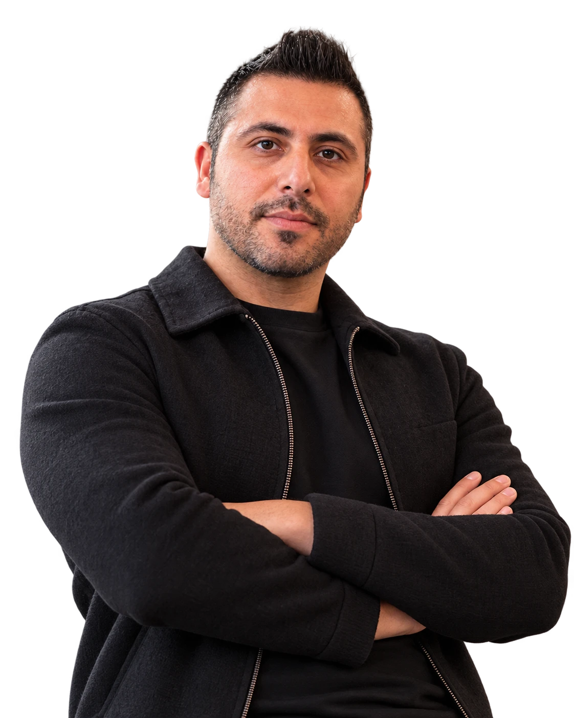 Portrait of Hossein Moghissi, arms crossed, in a black jacket